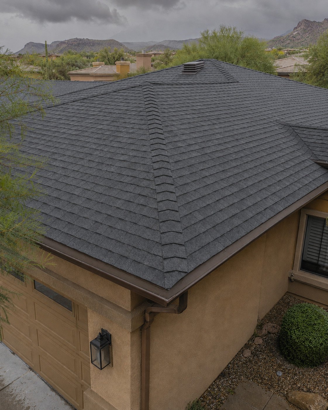 The same home after a full shingle replacement, the hips clean and the field uniform
