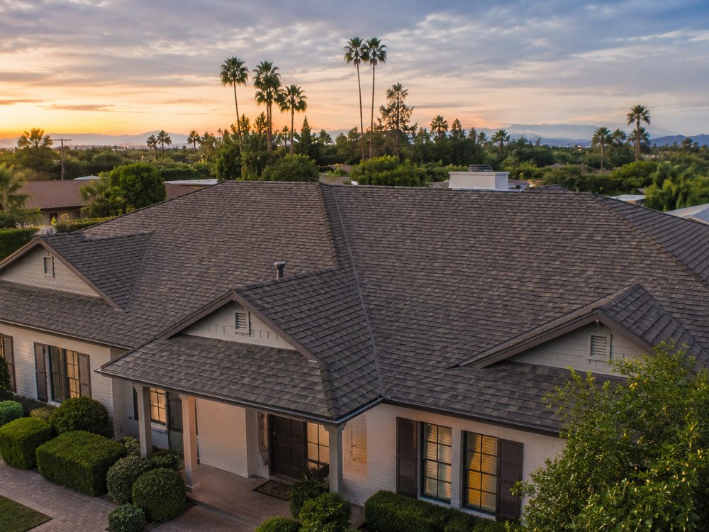 Architectural asphalt shingle roof photographed at sunset