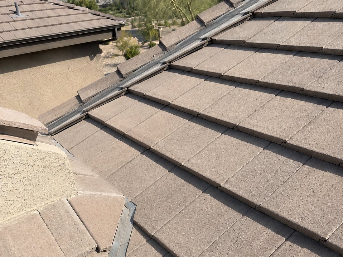 Concrete tile roof with the repaired valley relaid flush